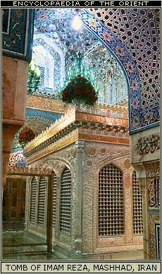 Twelver Shi'i Islam: Women putting on the right garment before walking over the the shrine of Imam Musa al-Kazim. Baghdad, Iraq.