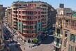 The street running down to the left of the pink hotel is Sharia Talaat Harb, the most popular downtown street in Cairo.